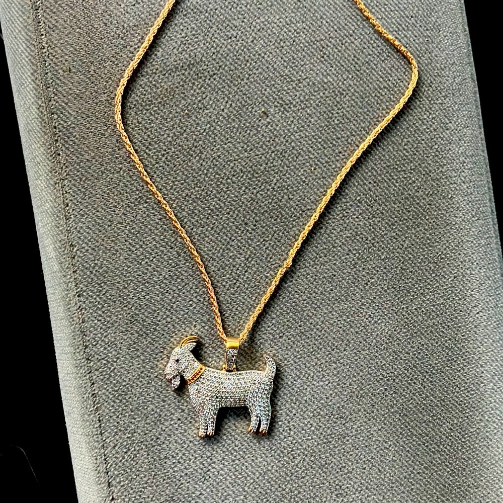 Diamond incrusted gold goat necklace